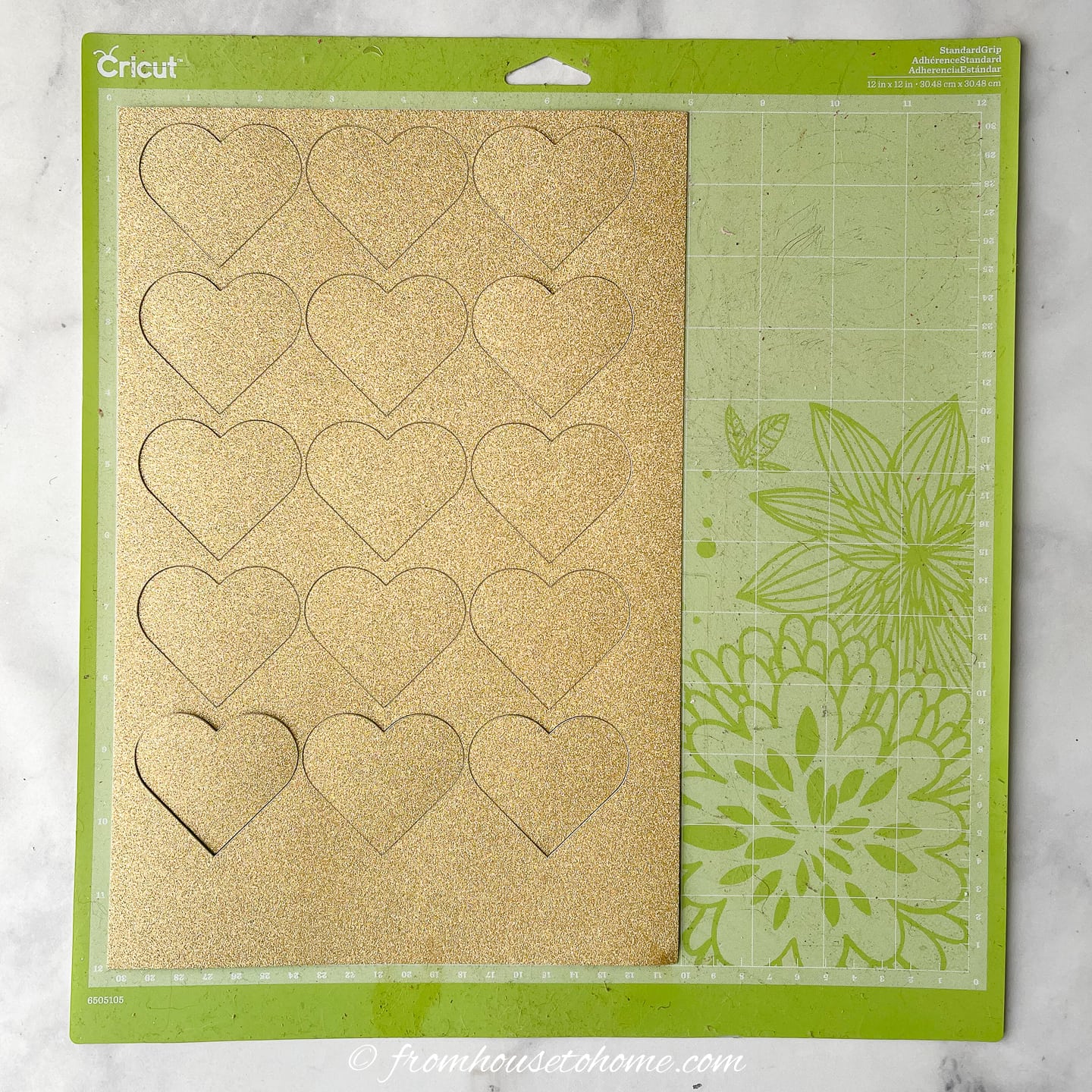 Gold glitter hearts on a cricut mat