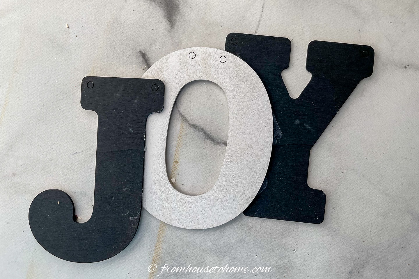 black and white "JOY" ornament
