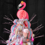 pink flamingo tree topper on top of a flamingo Christmas tree