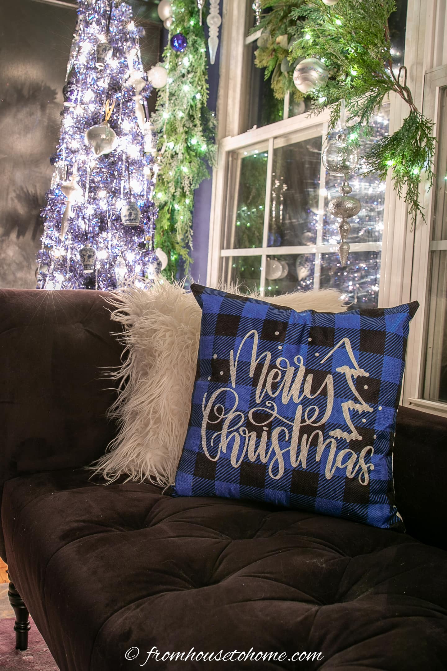 Blue and white Christmas cushions on a sofa