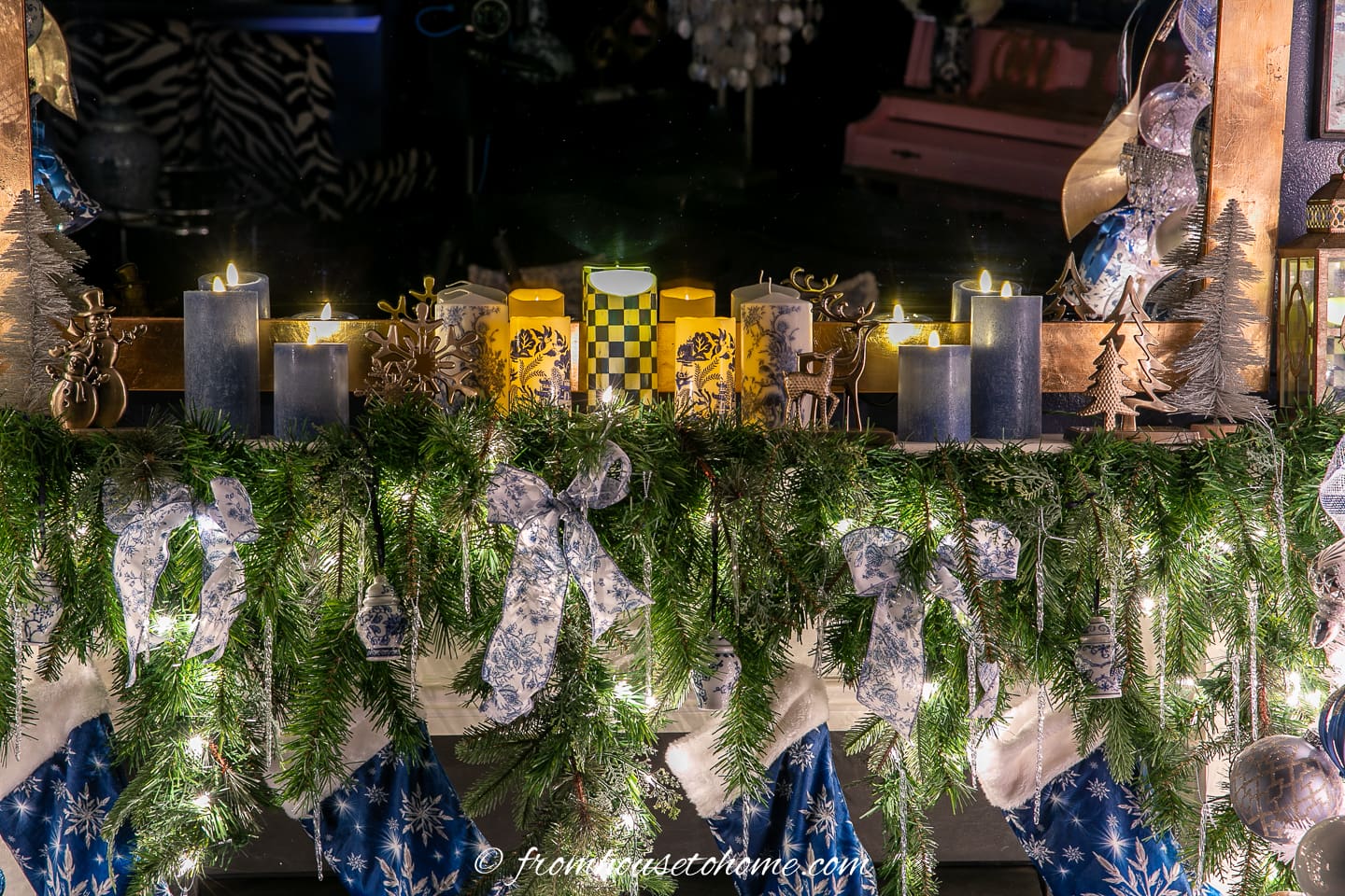 Blue and white candles on the fireplace mantel