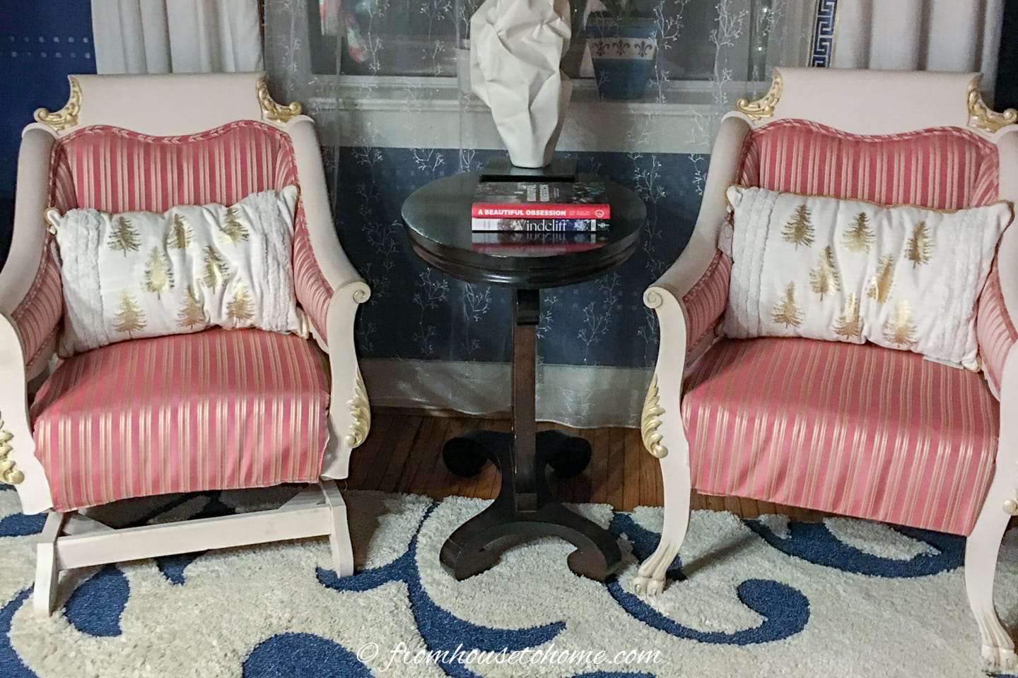 White and gold Christmas cushions on 2 chairs in a living room