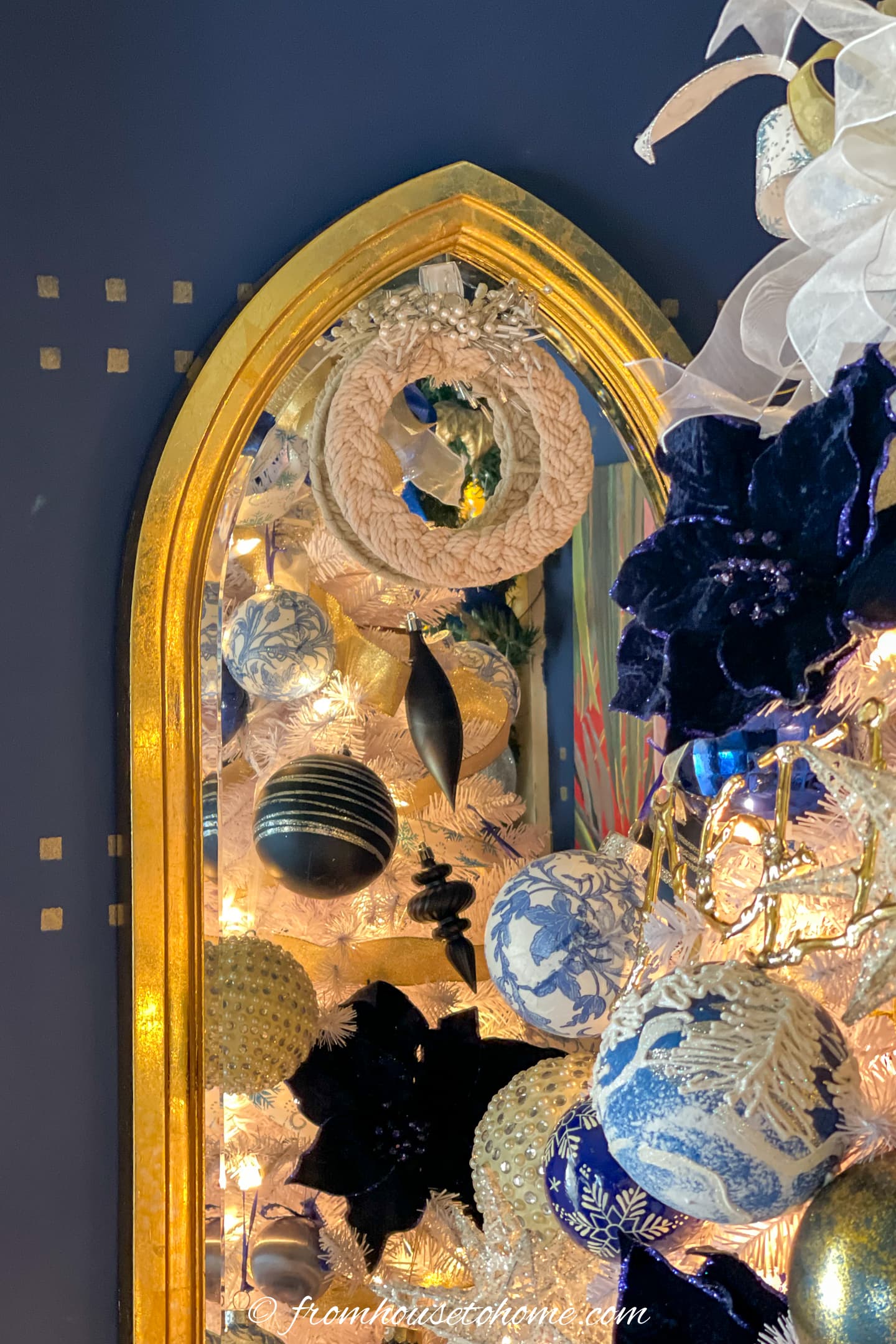 Mirror with a Christmas wreath hung on it