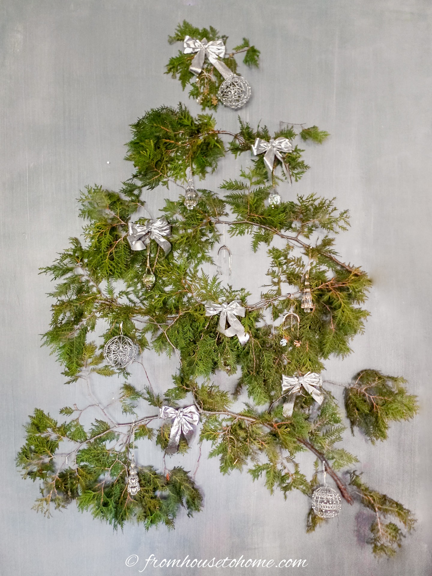 wall hanging Christmas tree made from evergreen branches