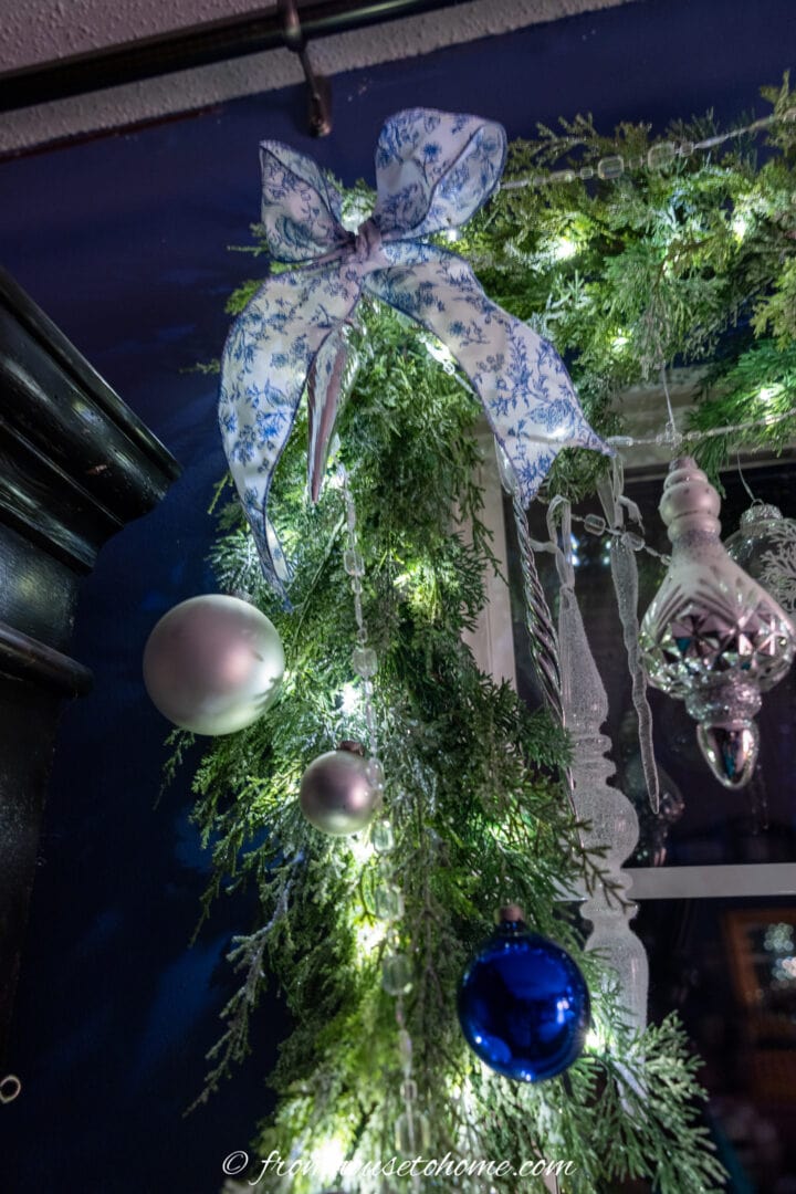 blue and white bow attached to a garland