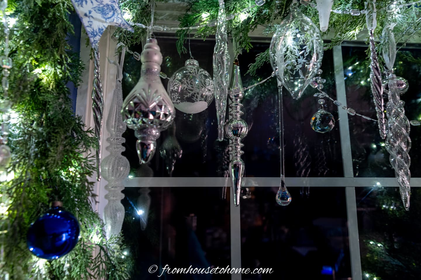 close up of glass ornaments hung from a garland