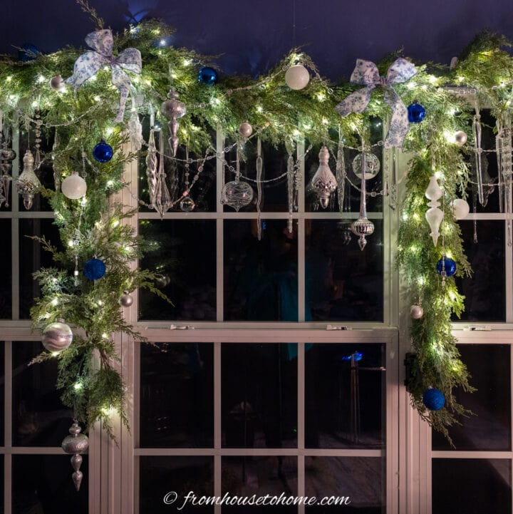 DIY Christmas window garland lit up at night