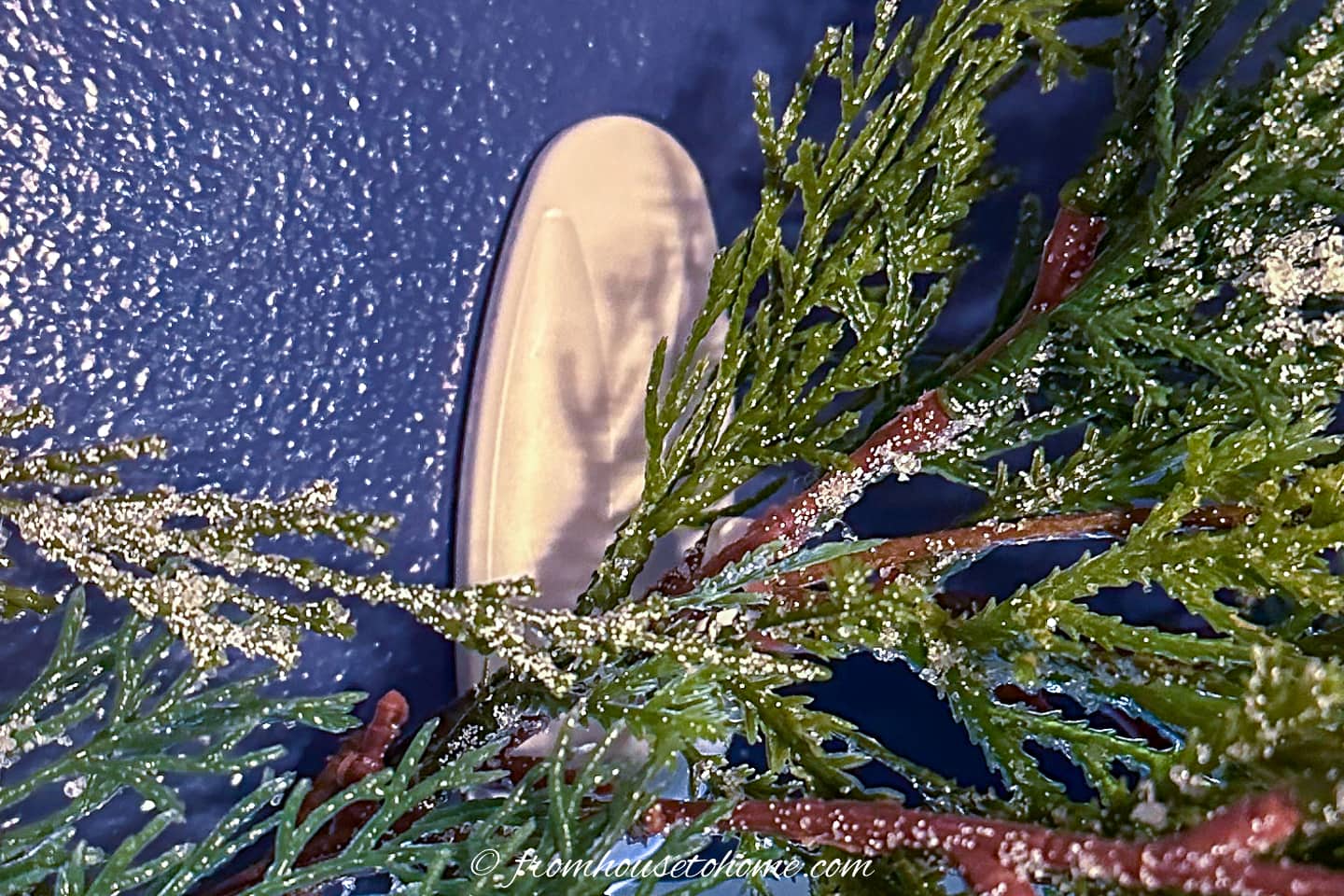 Command hook holding up a garland