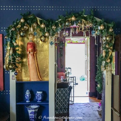 Indoor archway Christmas garland decorated with gold and crystal ornaments