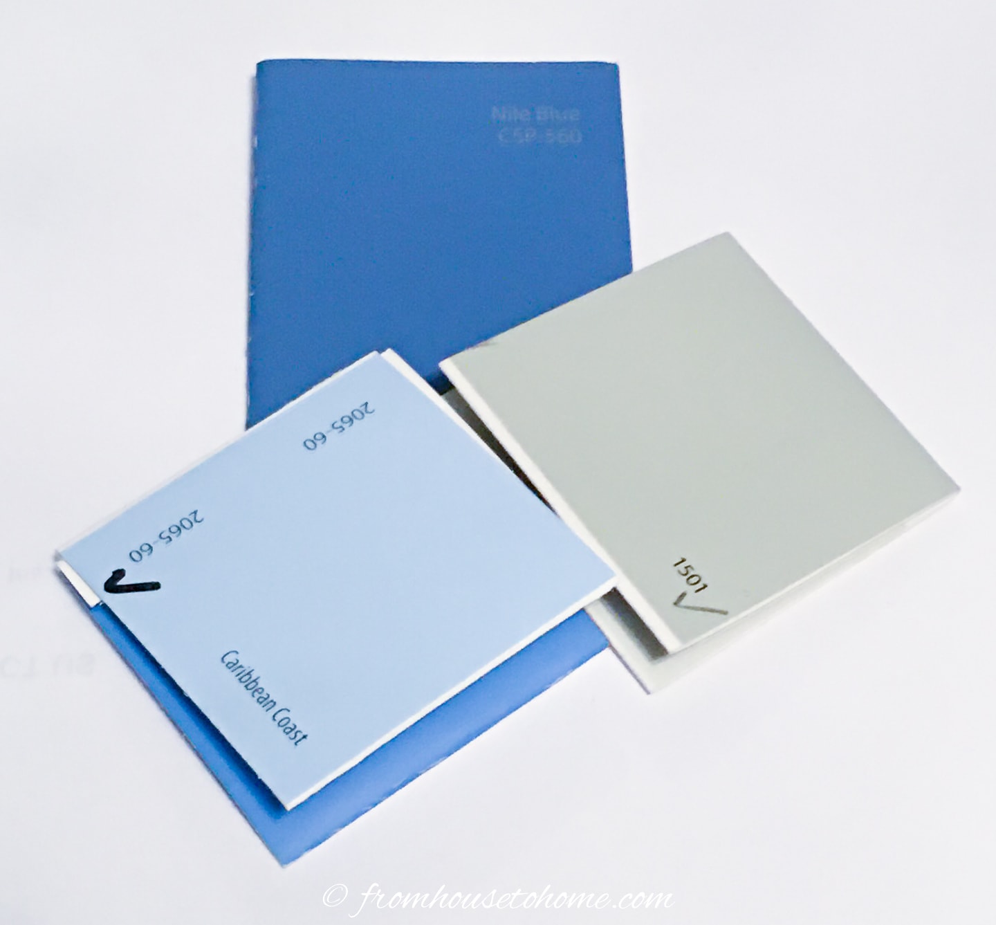Dark blue, light blue and green-gray paint chips