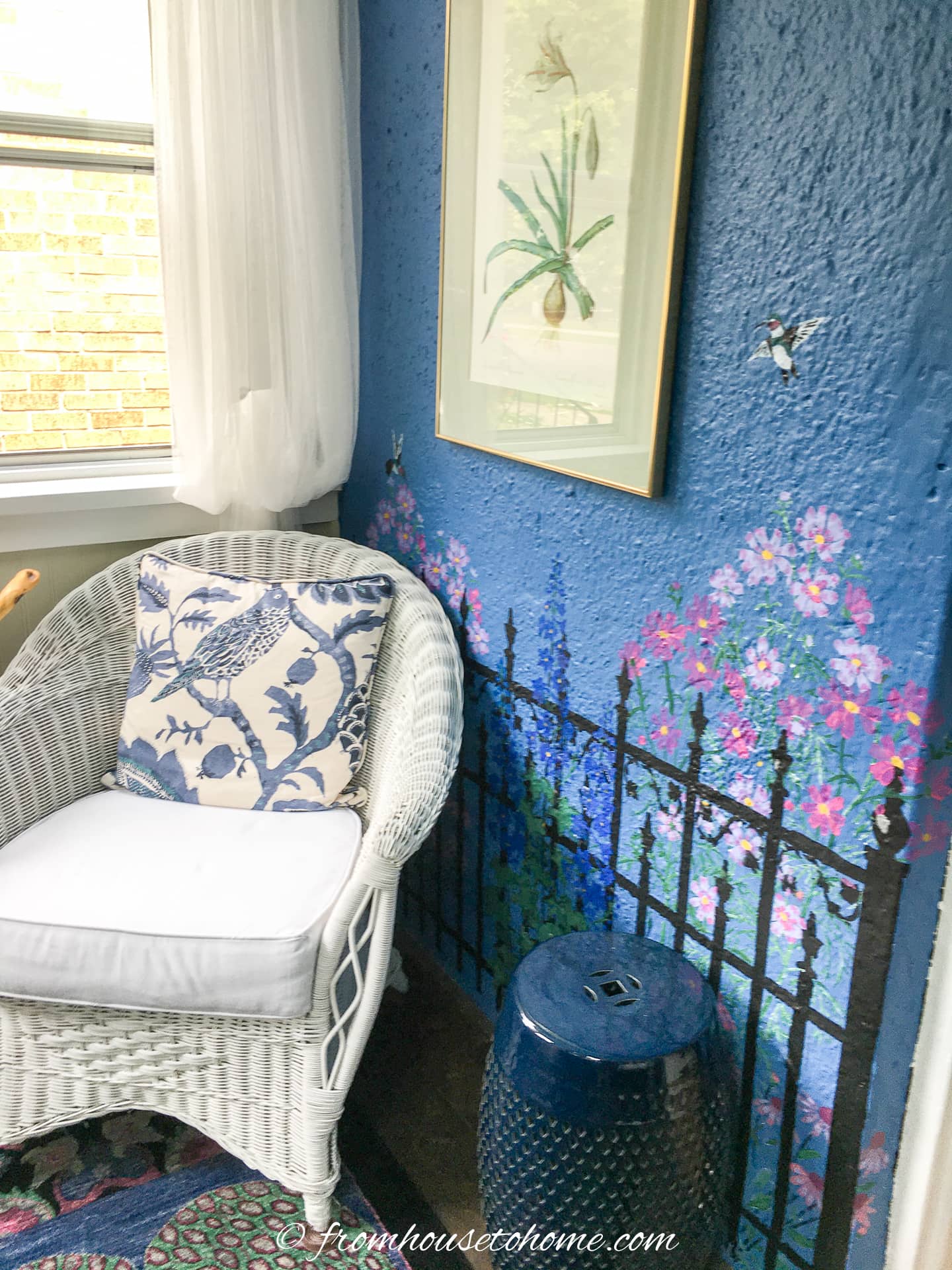 garden fence stencil on a blue porch wall