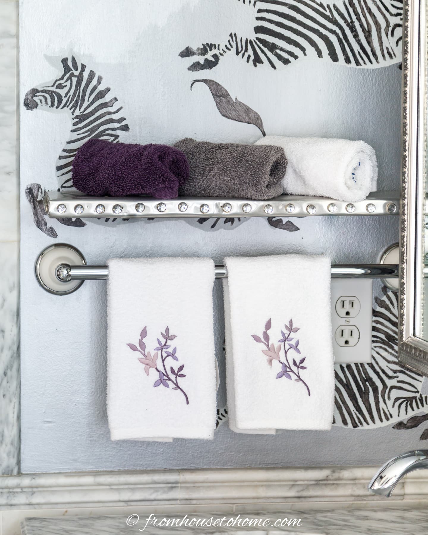 A small DIY bathroom shelves with towels
