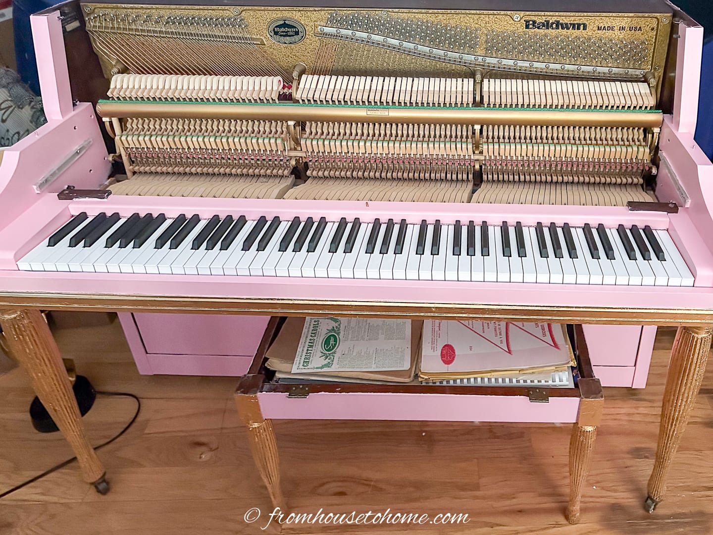 piano that has been taken apart and painted pink