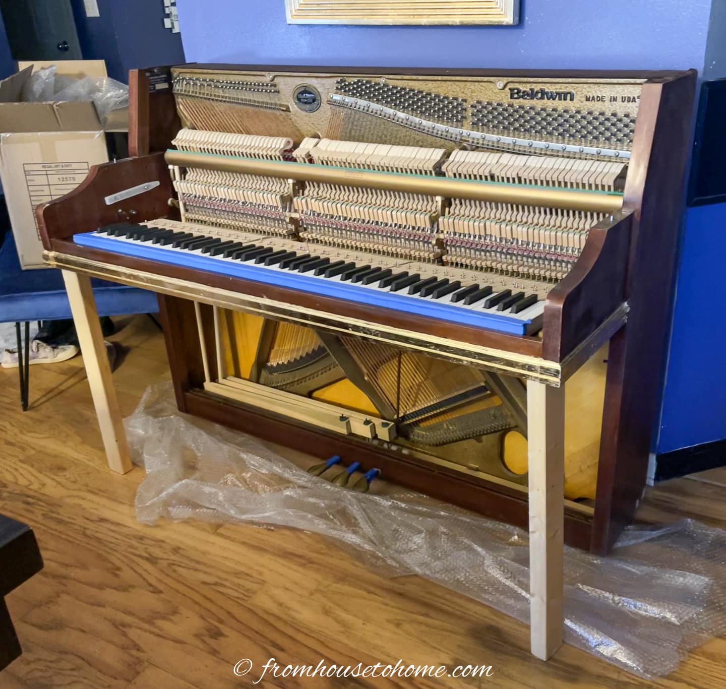 piano with temporary 2"x4" legs