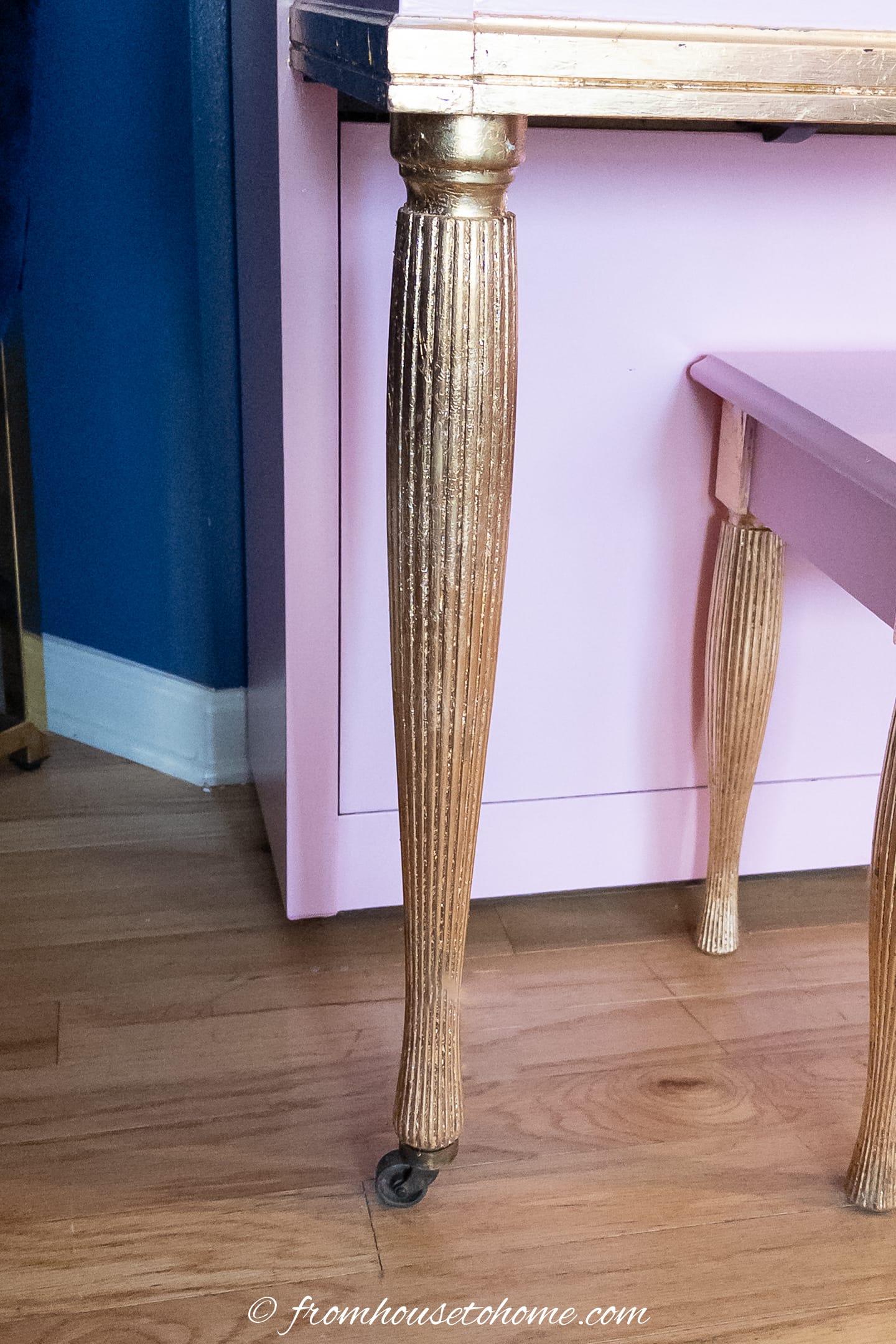 Grooved piano leg with gold leaf on it