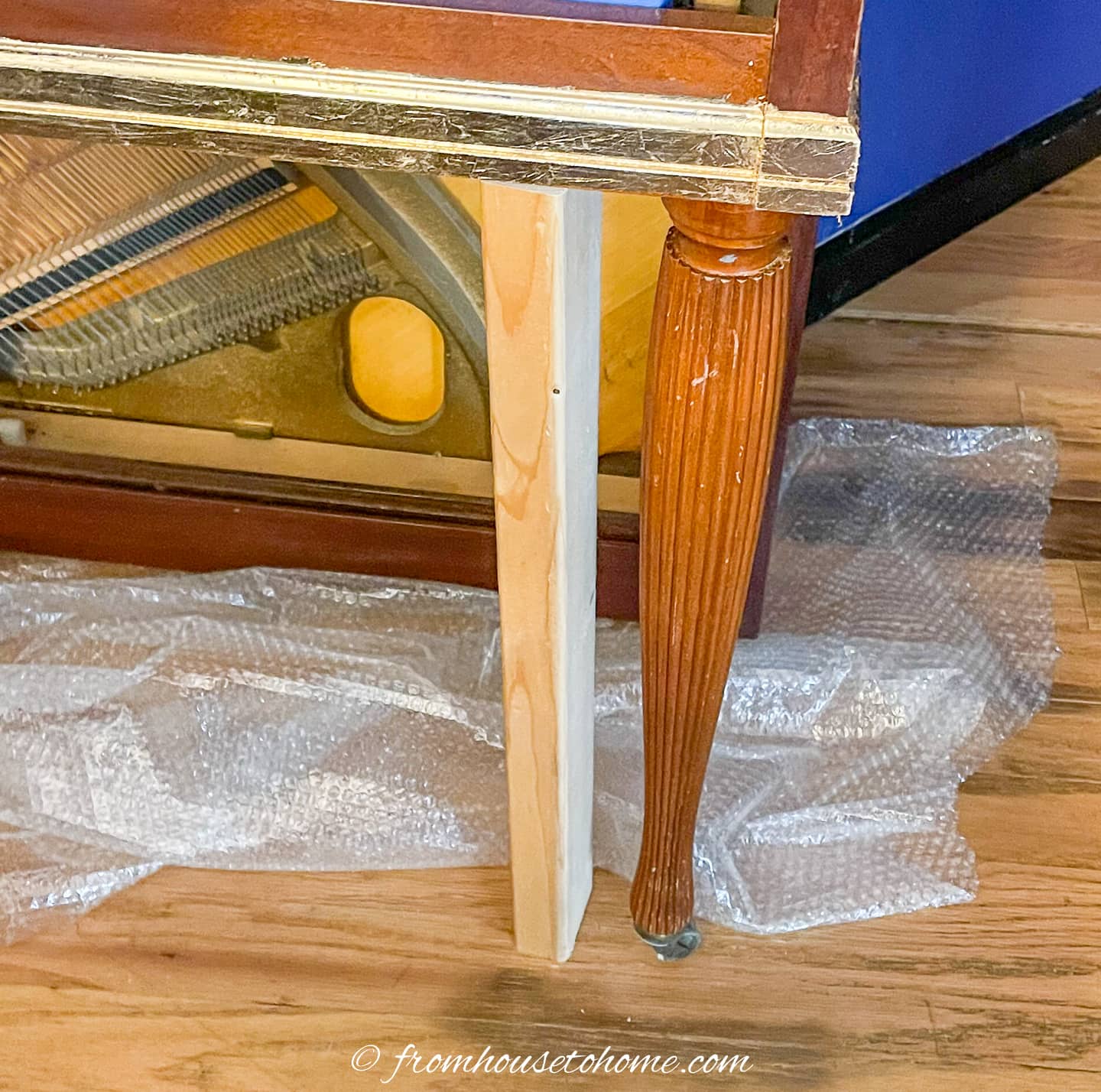 2x4 temporary leg under a piano