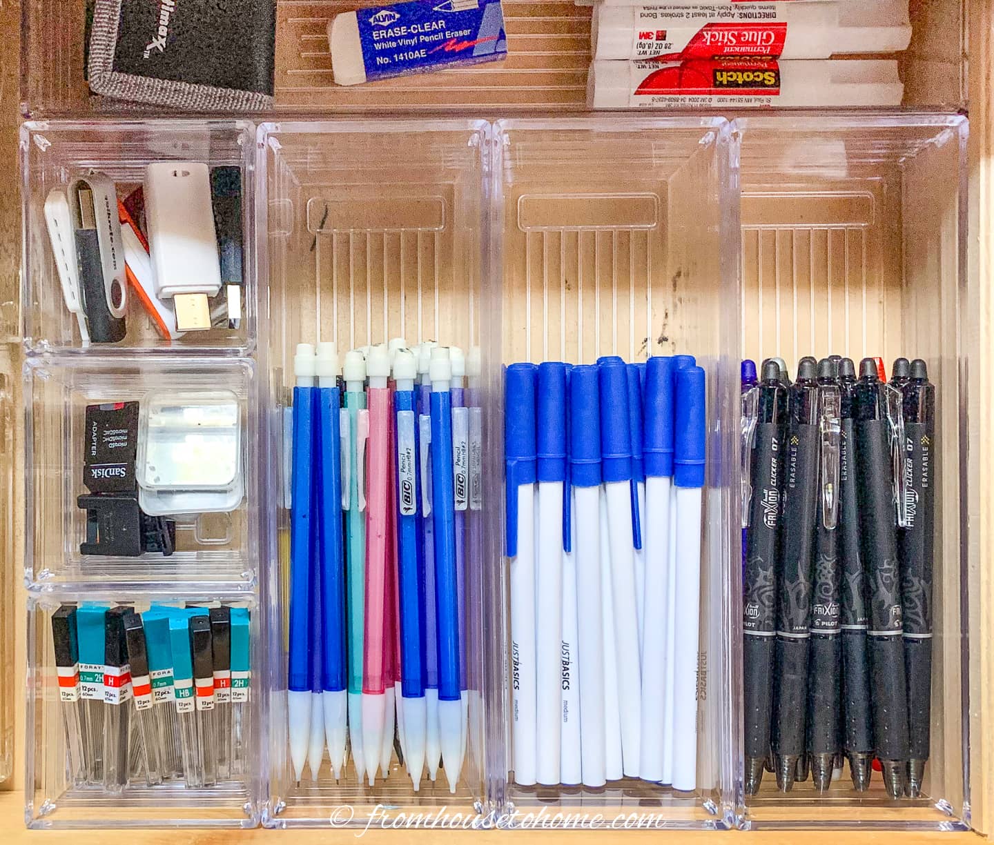 Pens and pencils in clear drawer organizers