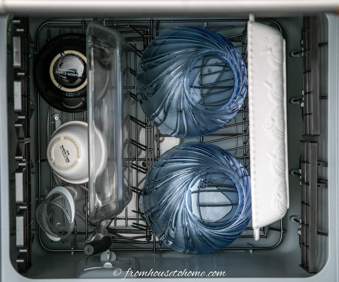 bowls and 9" x 13" baking dishes in the bottom drawer of a dishwasher