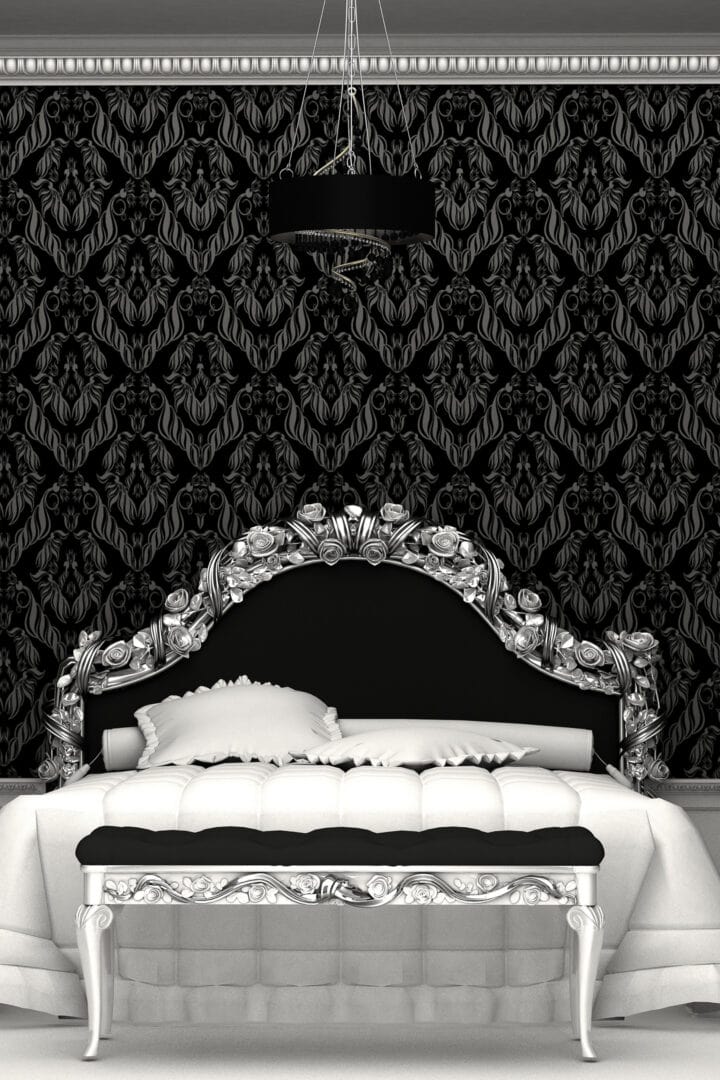 Black, white and silver bed in a bedroom with black wallpaper