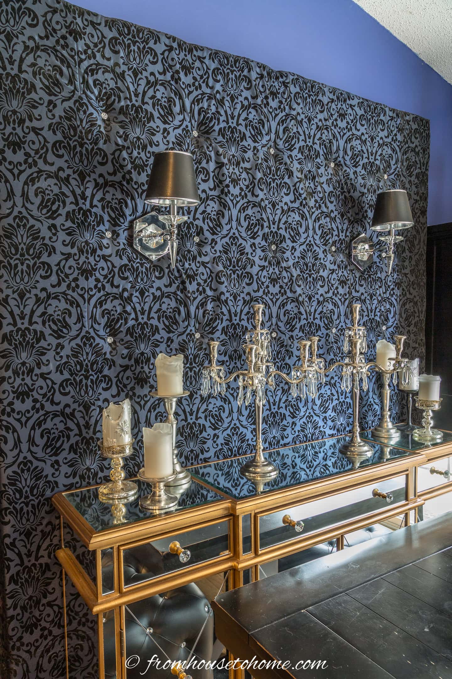 upholstered fabric backsplash behind a dining room buffet