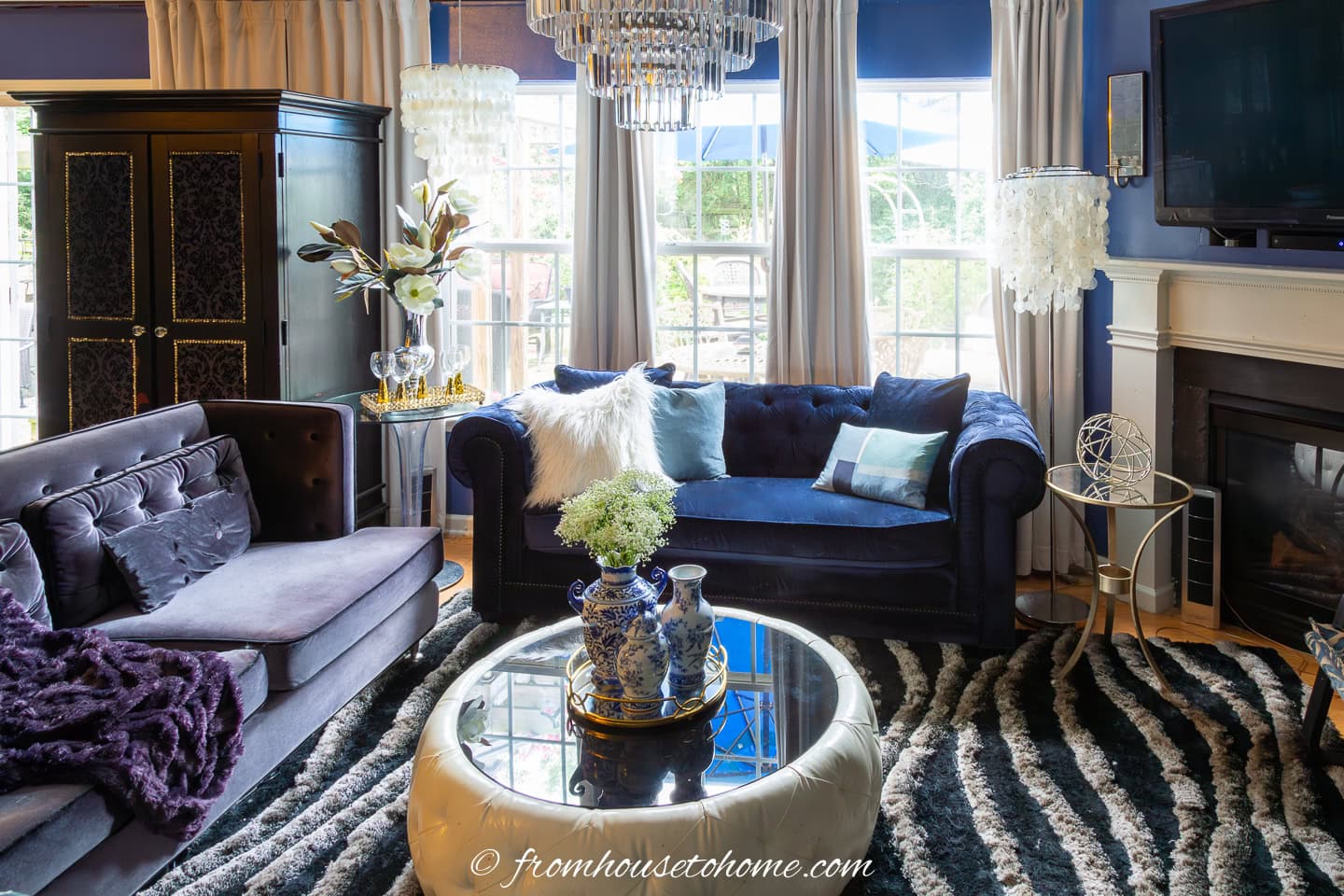 living room with 2 sofas perpendicular to each other beside an angled fireplace