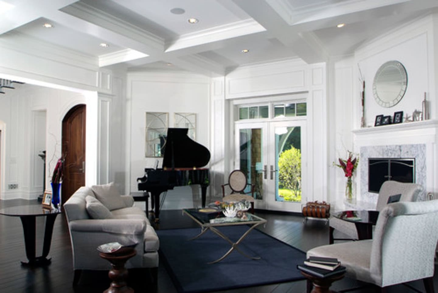 A fireplace placed directly in front of an angled fireplace in the living room