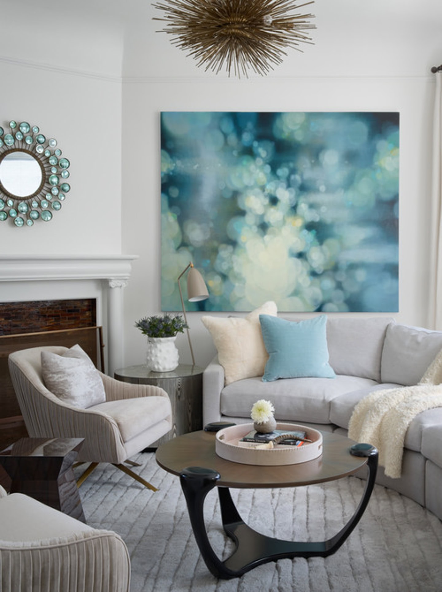 An angled sectional in front of a corner fireplace