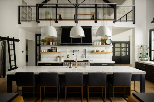 country kitchen with black cabinets and white walls