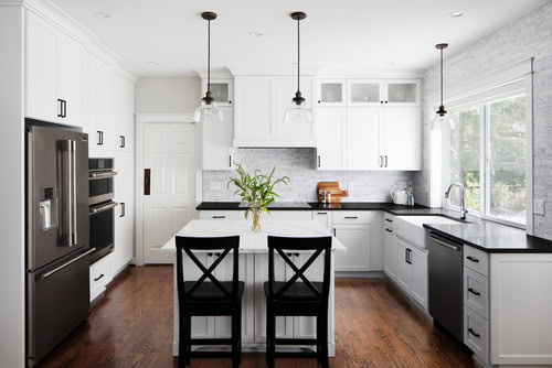 modern white kitchen with black countertops