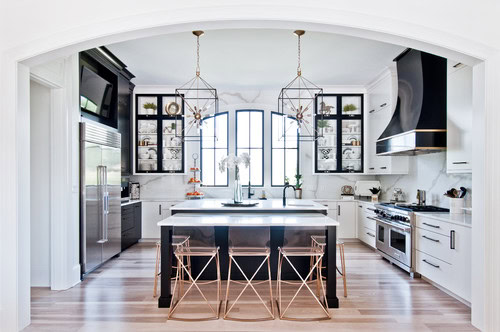 Traditional kitchen with a mixture of white and black cabinets and finishes