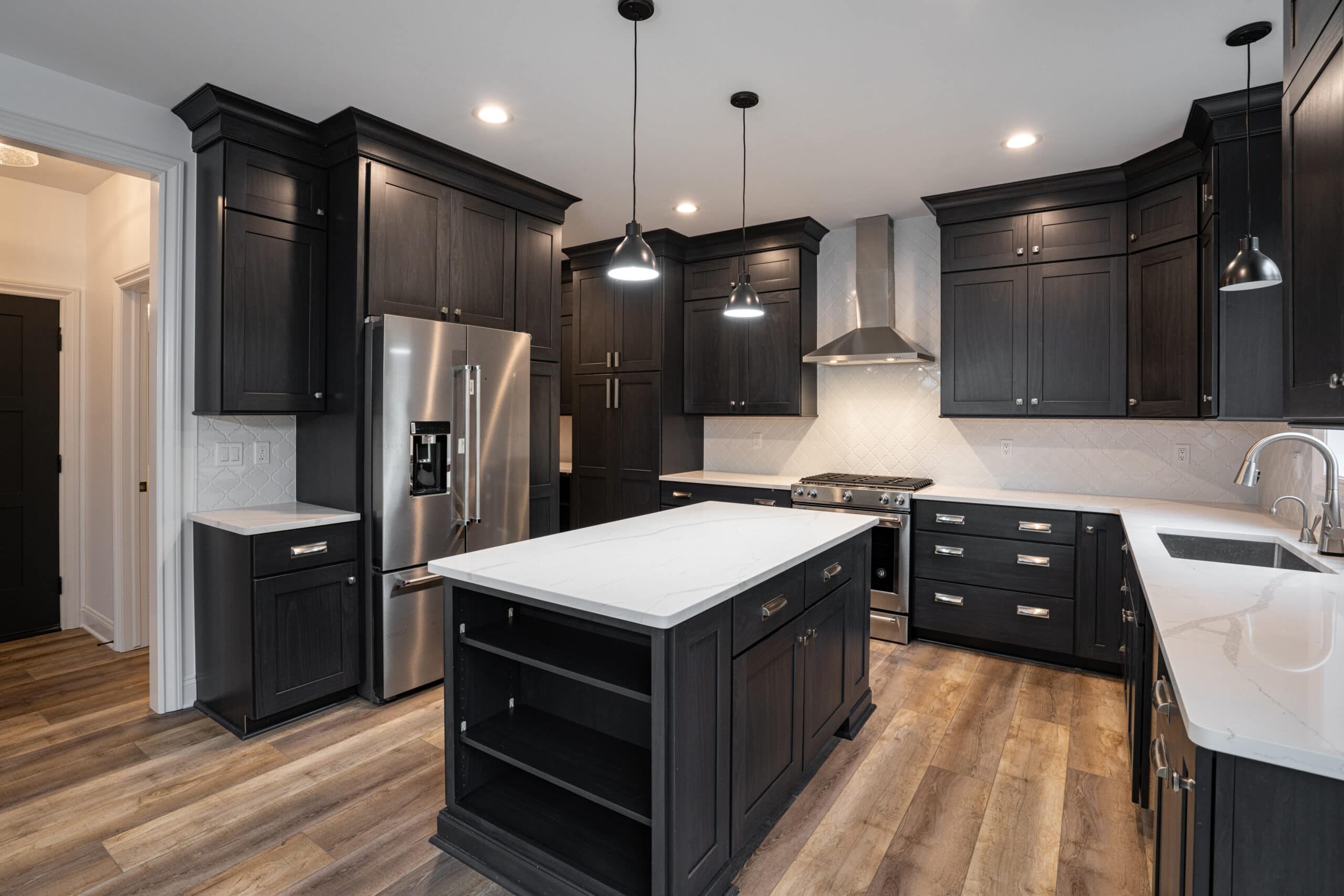 black cabinets with a white countertop