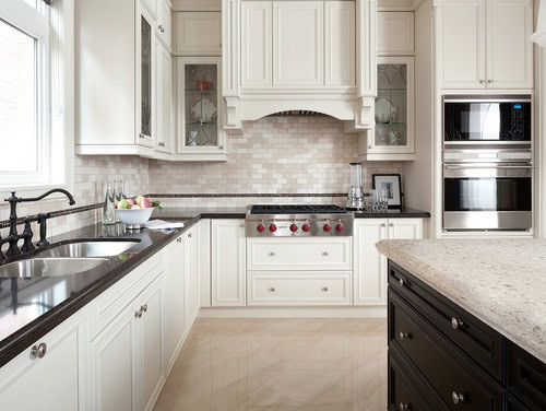 cream cabinets with black countertops