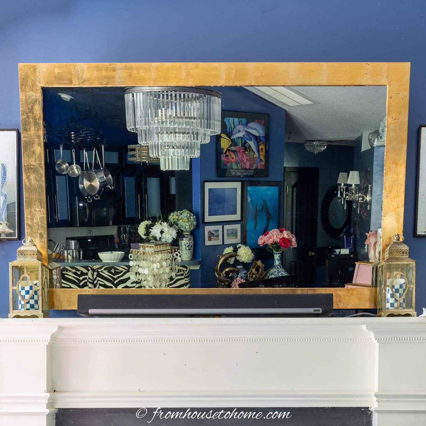 Mirror TV with a gold leaf frame