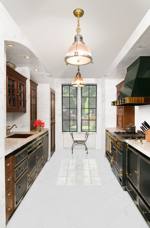 galley kitchen with black cabinets and brass trim