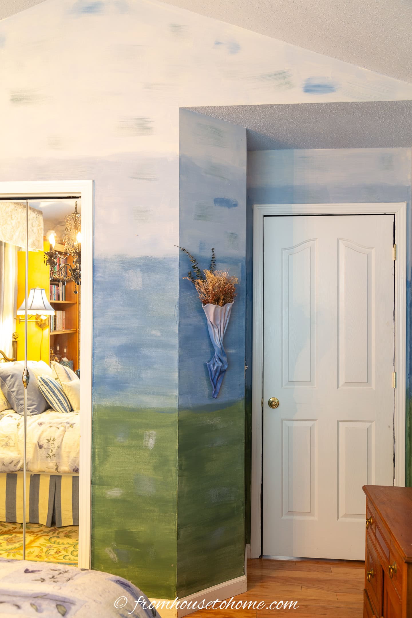 Green to blue ombre wall painted with a watercolor technique