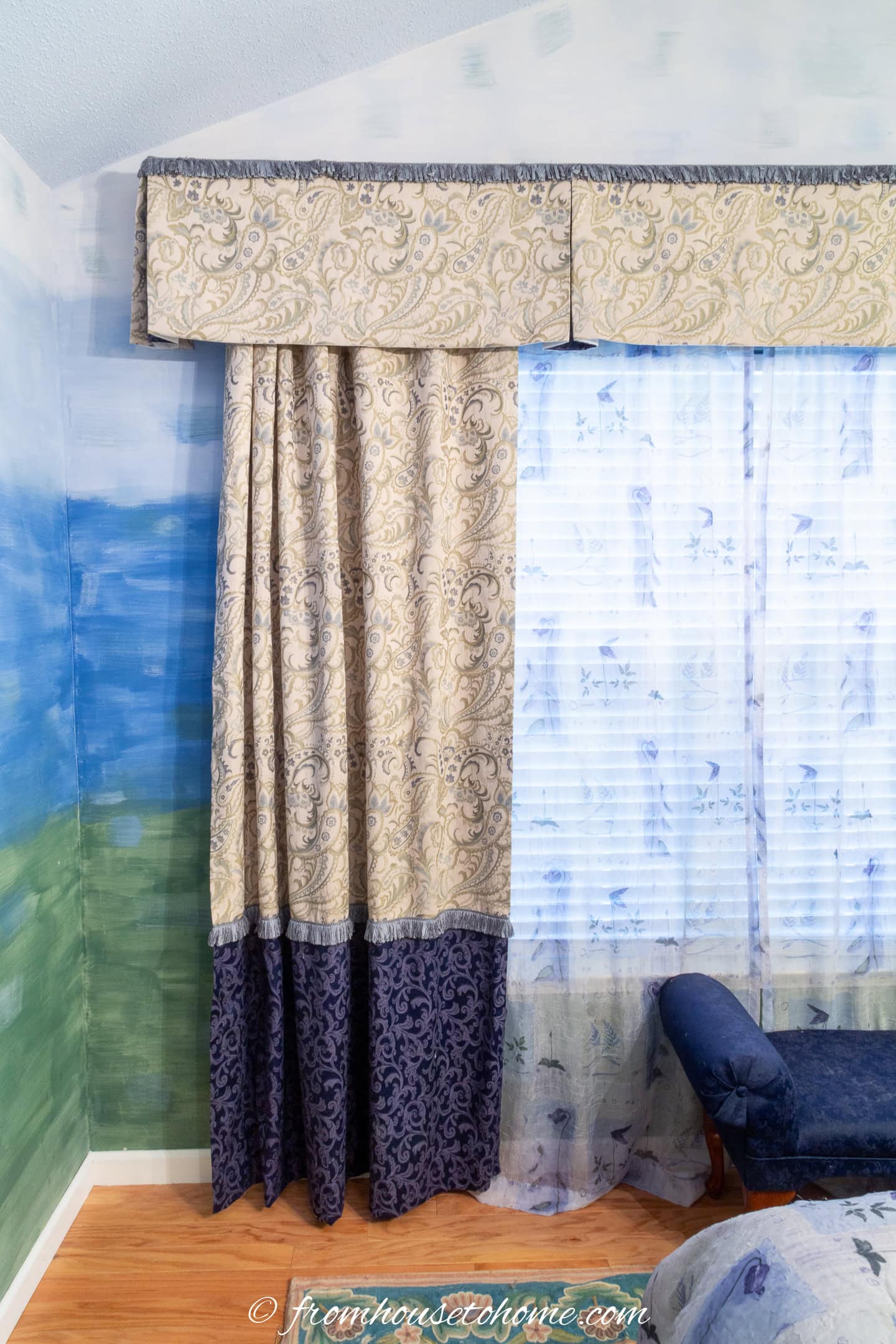 Dark blue and cream paisley curtains and valence over a large window