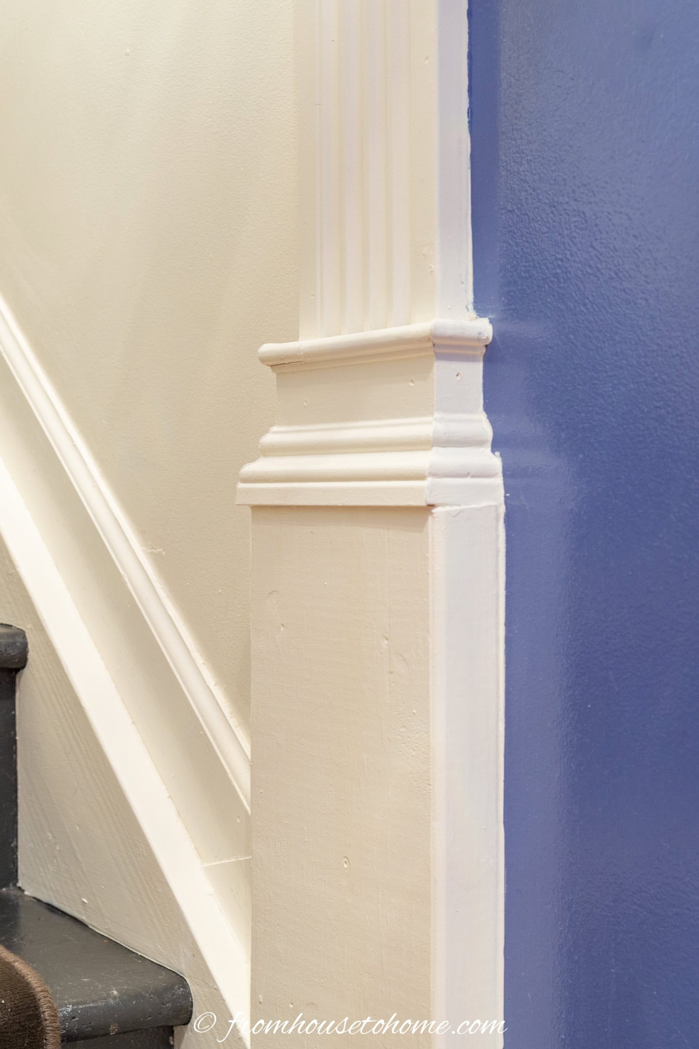 the bottom of the column moldings in a stairwell