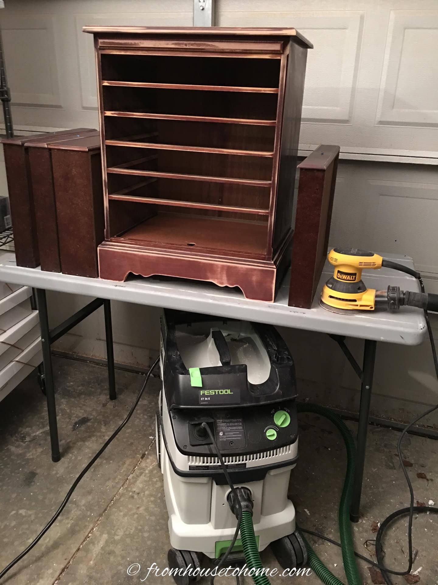 The sanded nightstand with a random orbital sander