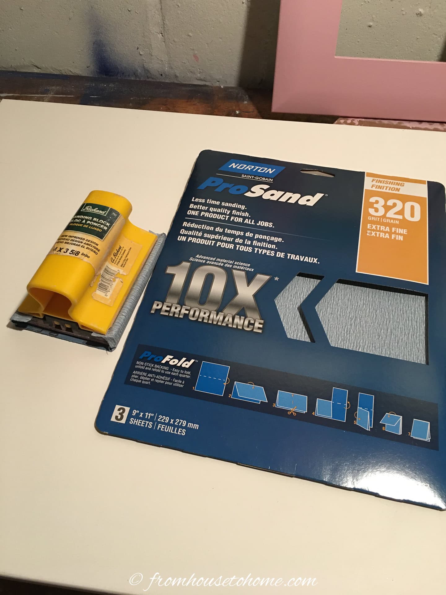 320 grit sand paper beside a sanding block