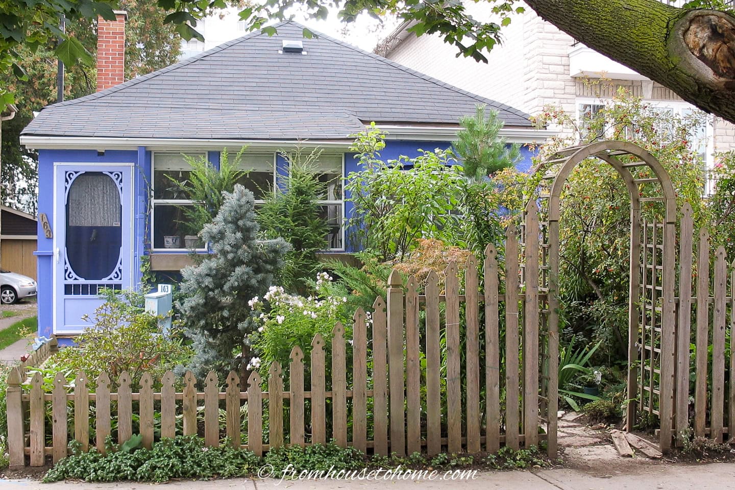 A stucco house painted purple