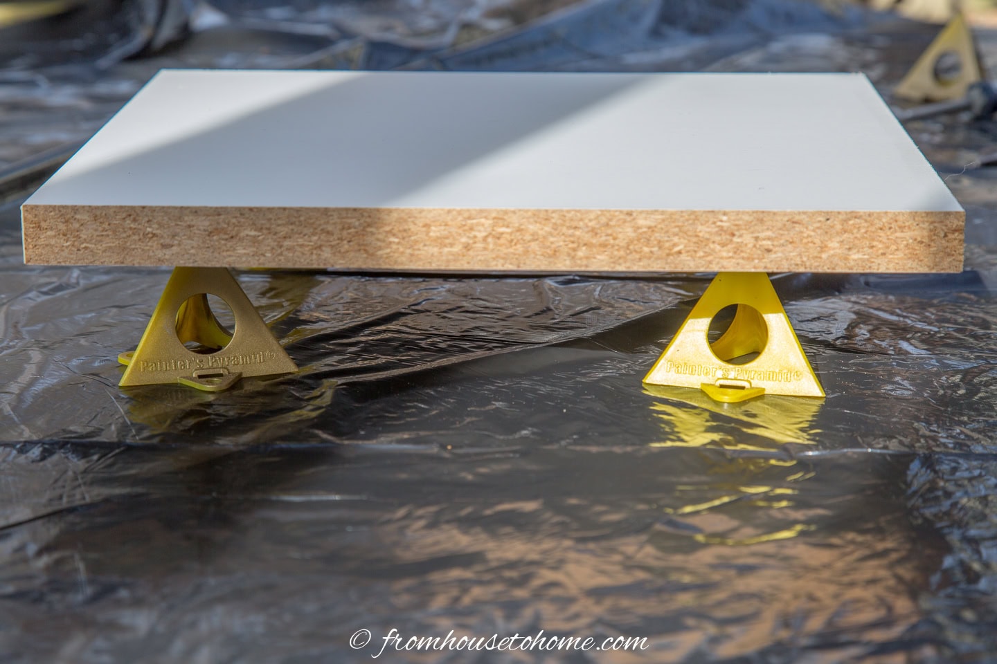 A piece of melamine on paint pyramids