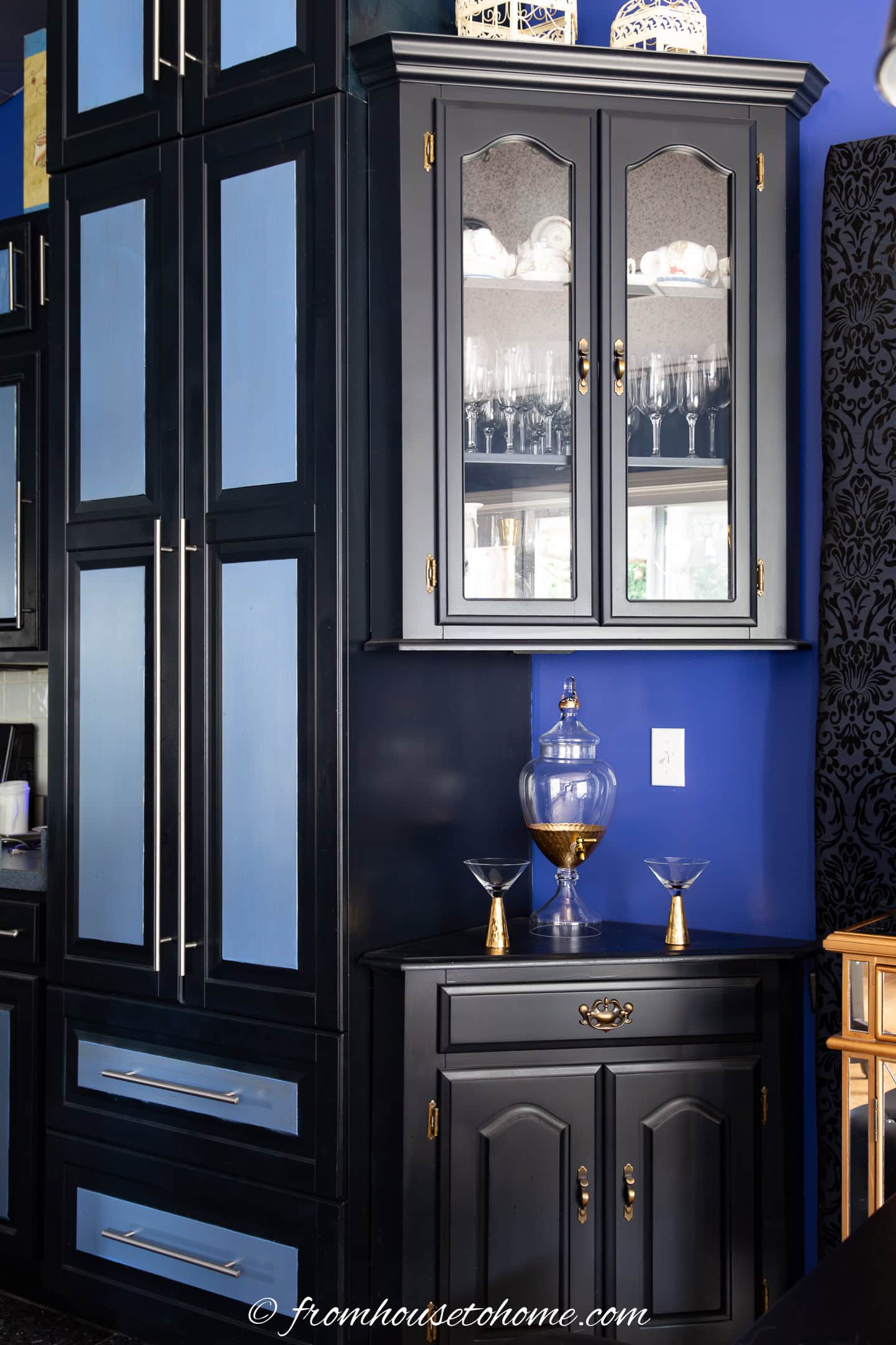 Black and blue kitchen cabinets painted with a paint sprayer