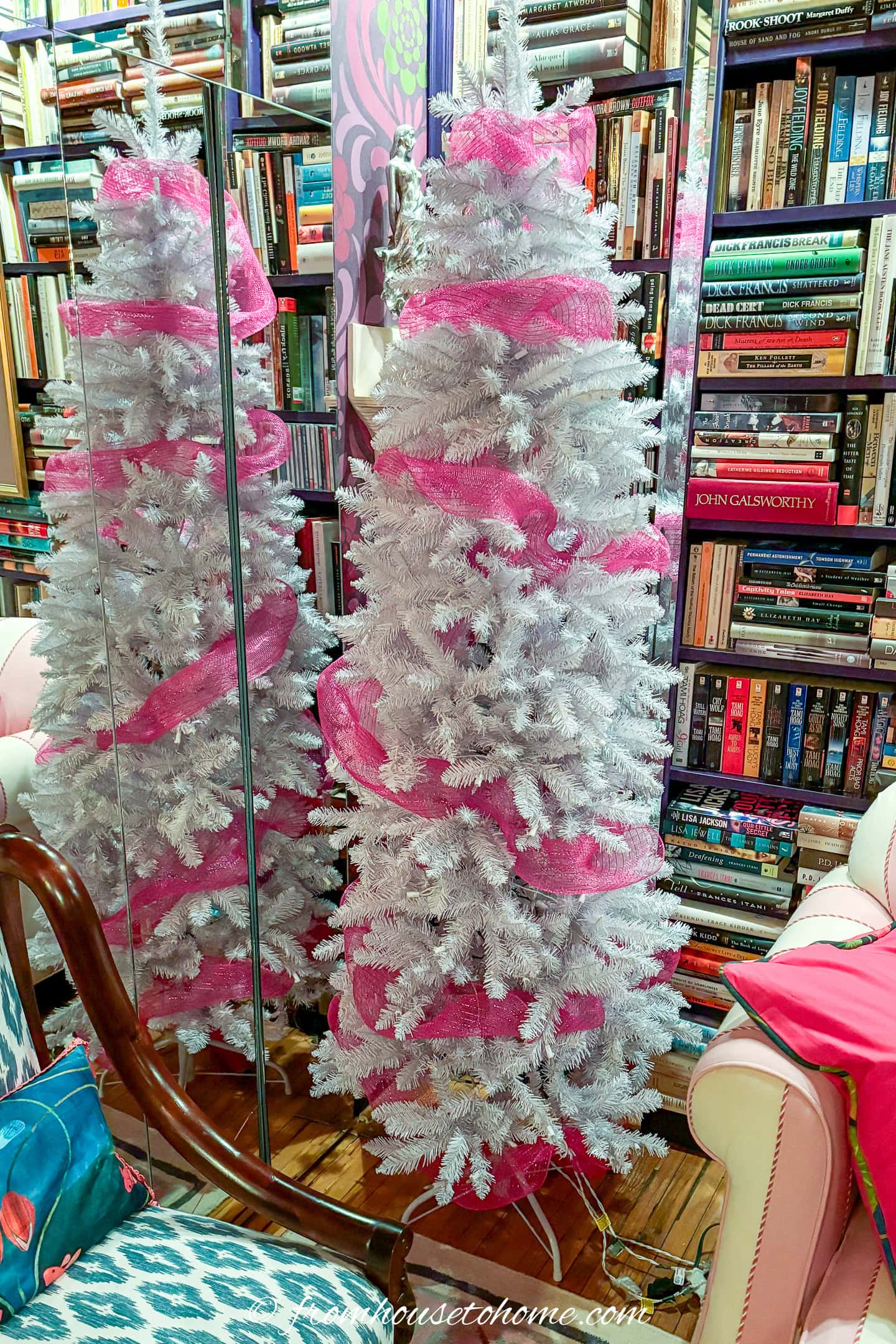 white christmas tree wrapped with fuchsia pink deco mesh
