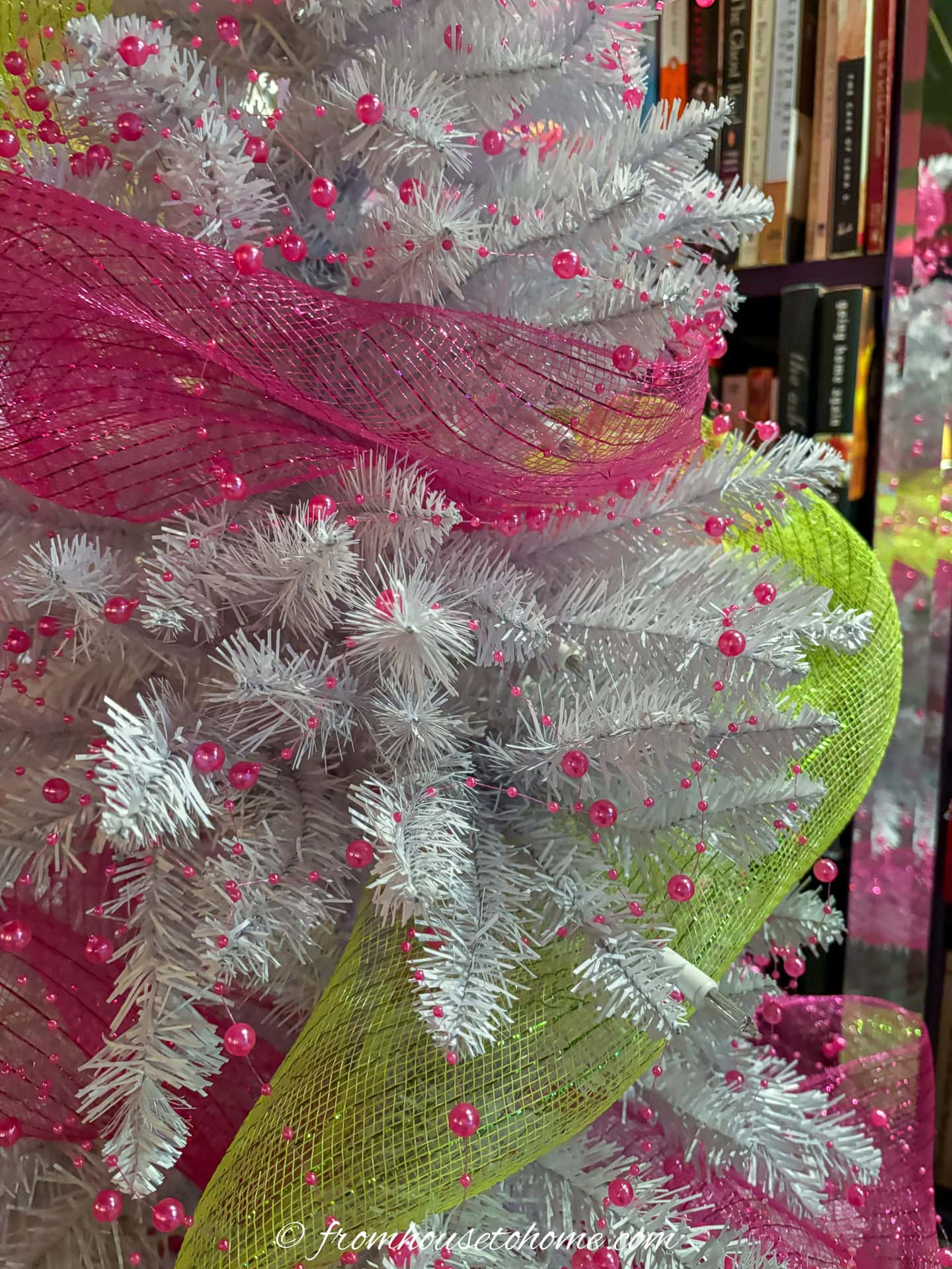 white christmas tree wrapped with fuchsia pink and lime green deco mesh and pink bead ribbon
