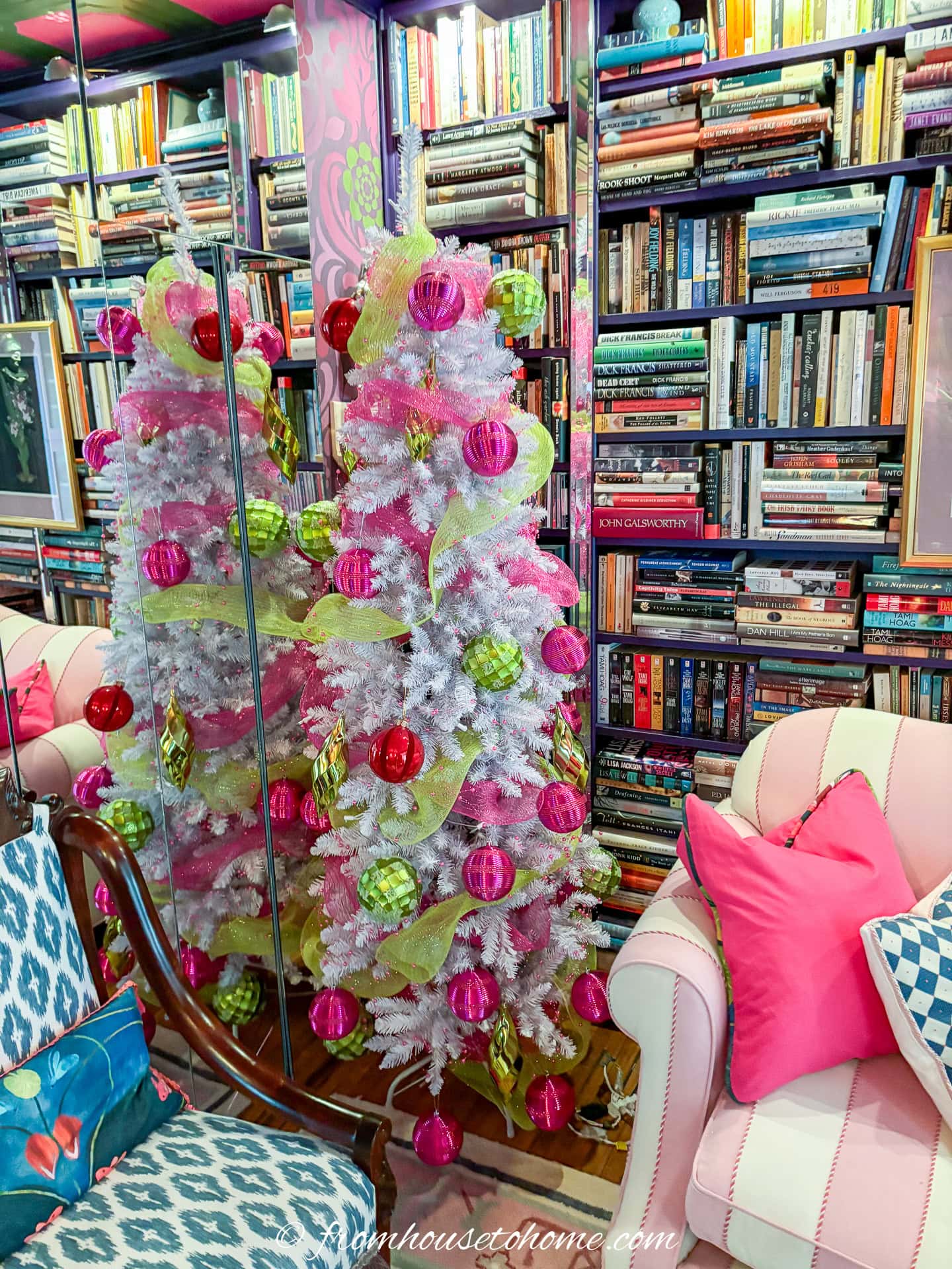 white christmas tree with fuchsia pink and lime green ribbons and large ornaments