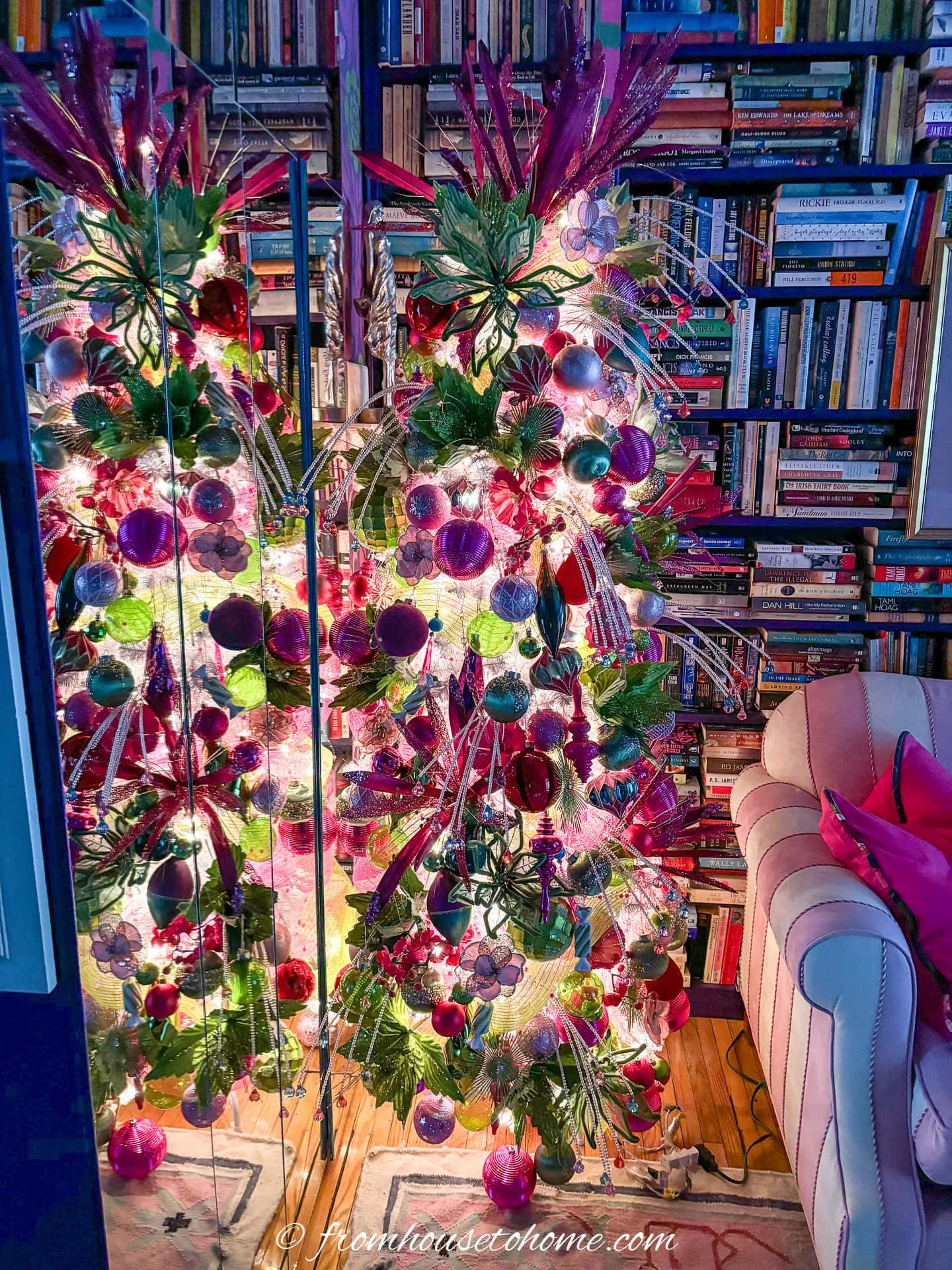 pink and green christmas tree with lights turned on