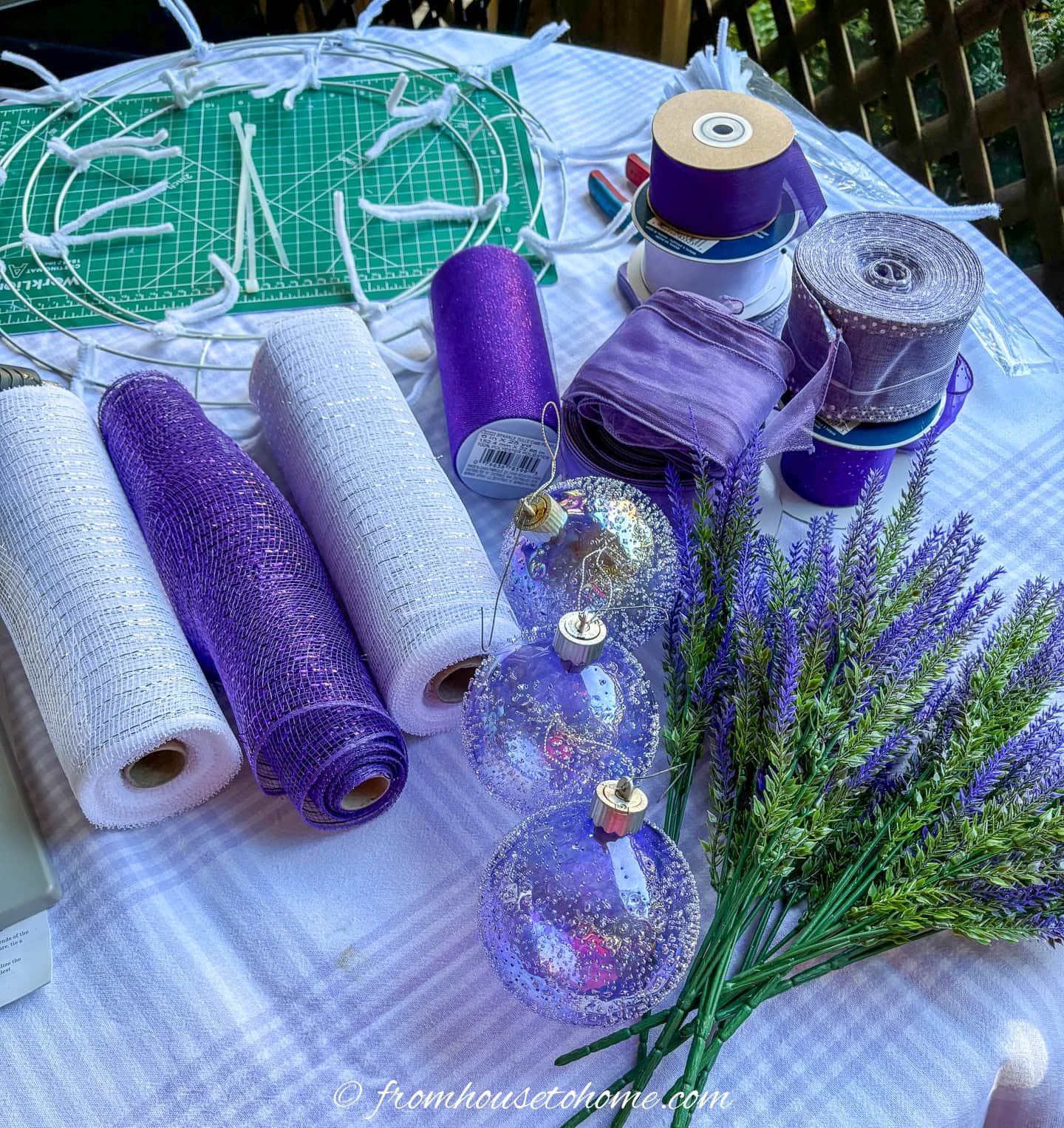 lavender and purple ribbon, ornaments and picks for a Christmas wreath