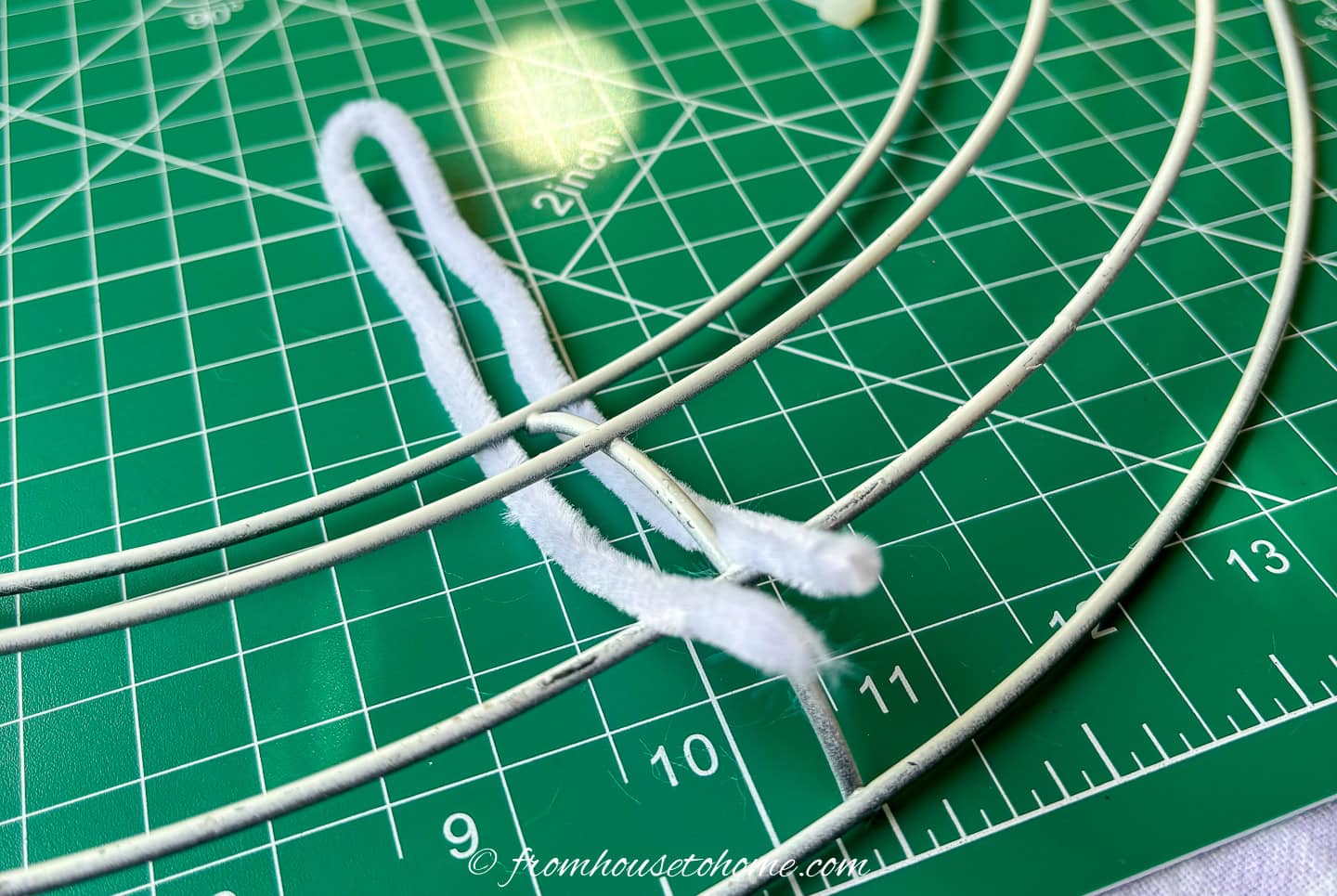 pipe cleaner under the inner rows of a wire wreath form