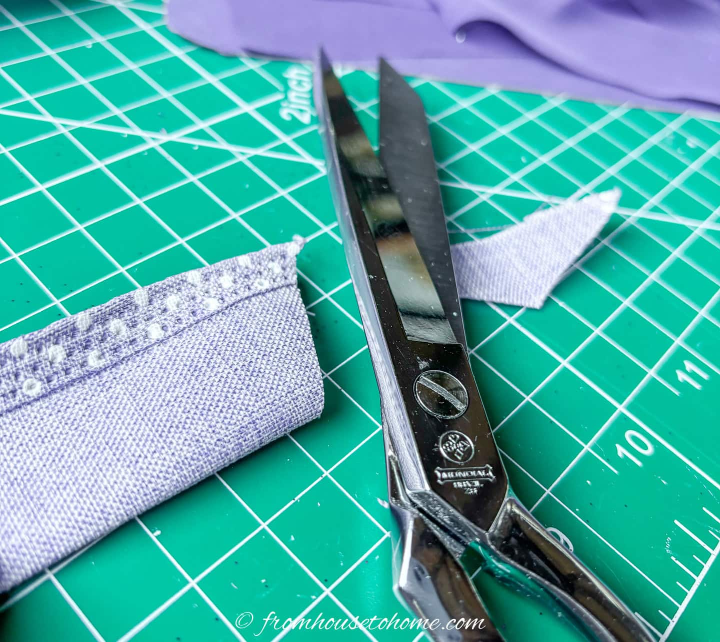 A ribbon folded in half with a corner cut off