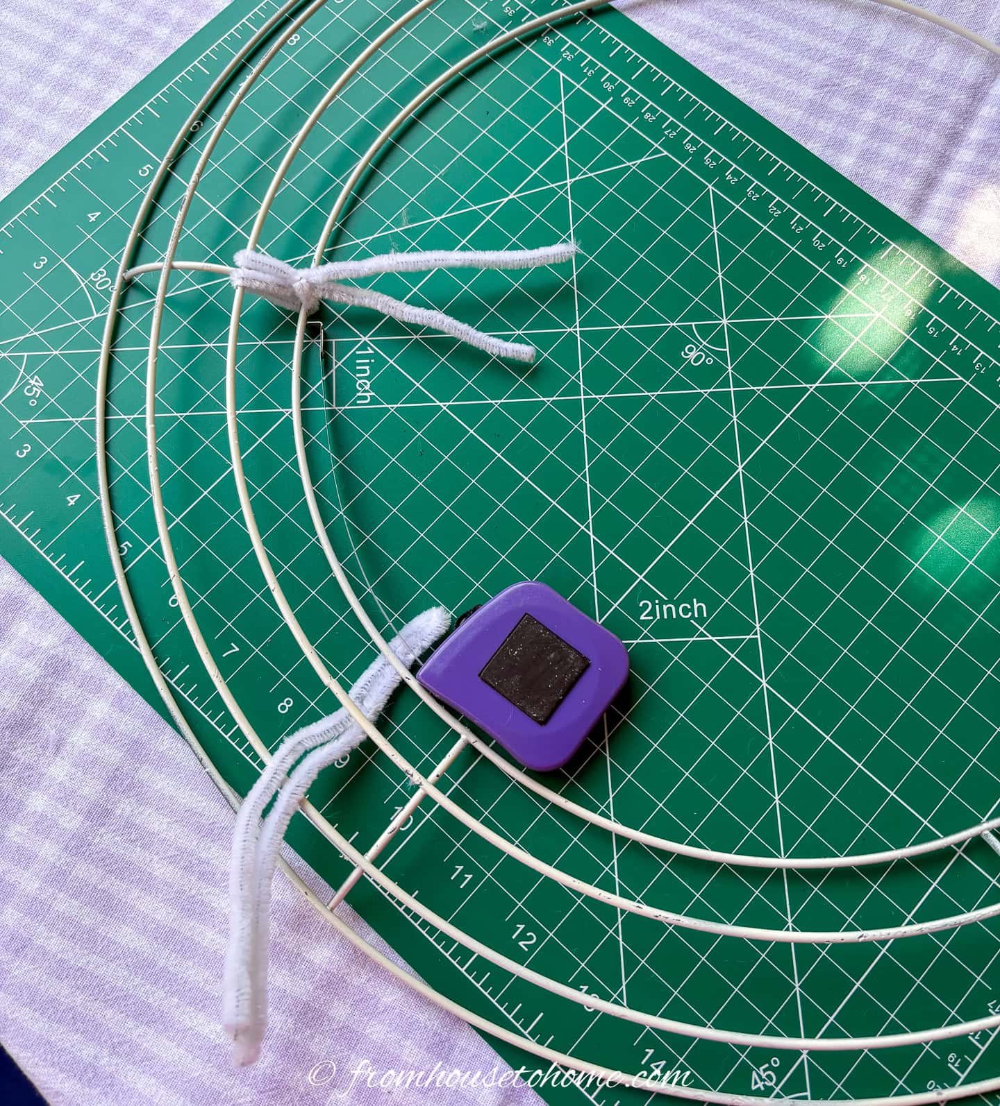 position of the second pipe cleaner on the inner row of a wire wreath form